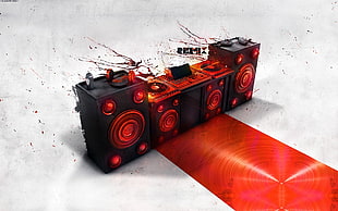 four black and red stereo speakers